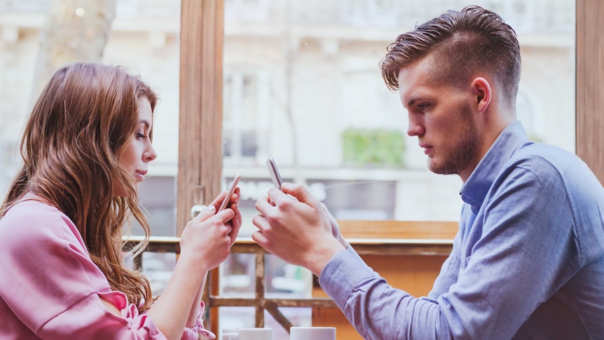 Couple using smartphone