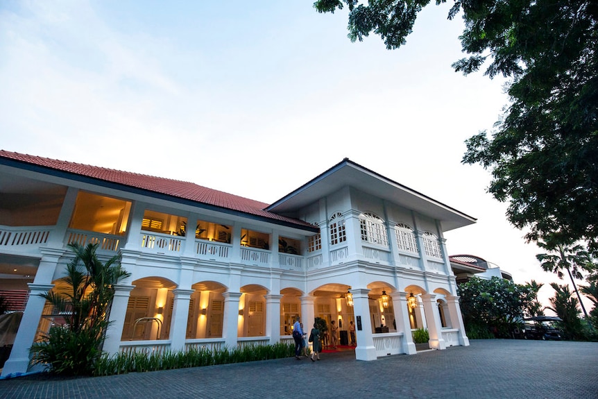 An entrance glows outside the Capella Hotel on Sentosa Island