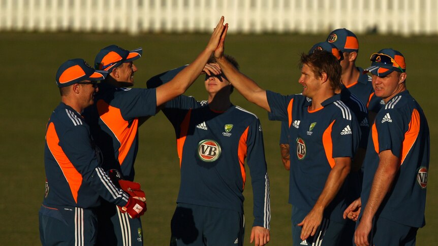 Stand-in Australian skipper Shane Watson (right-centre) celebrates a wicket with team-mates.