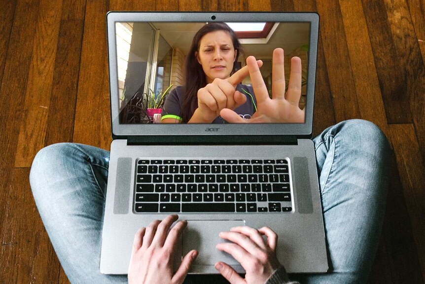A laptop open with an image of a woman counting on her fingers.