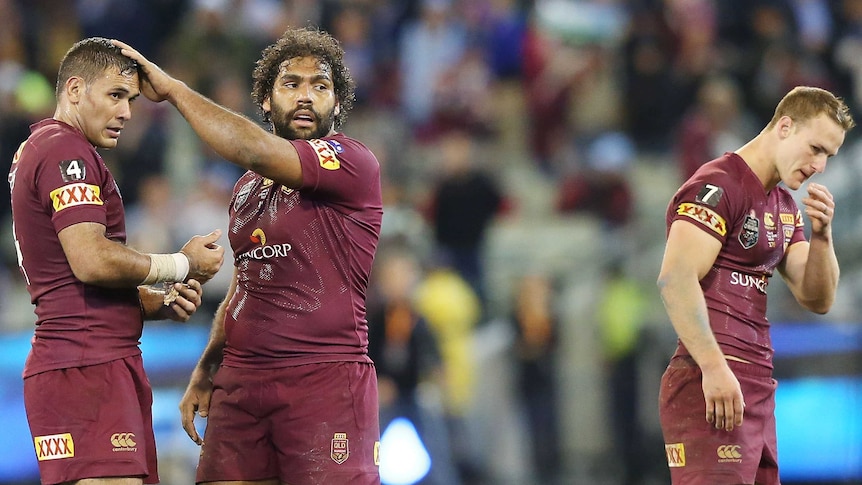 Night to forget ... Daly Cherry-Evans (R) reflects on the loss to the Blues, as Justin Hodges (L) and Sam Thaiday look on