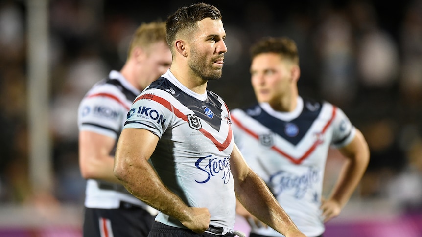 NRL player walking with his hands on his hips during a match 