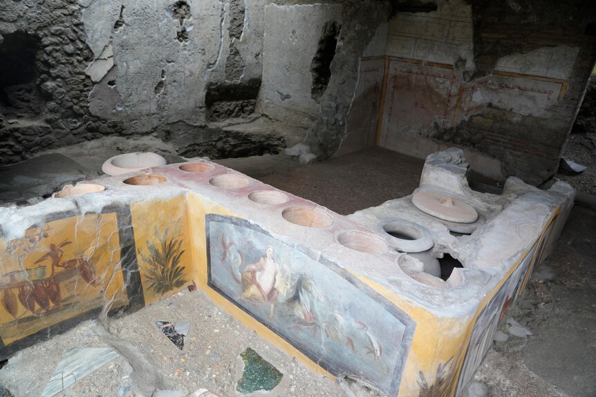 An ancient table top which was a commercial food establishment in Pompeii.