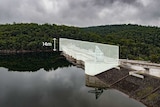 A picture of a dam with an image of it raised.