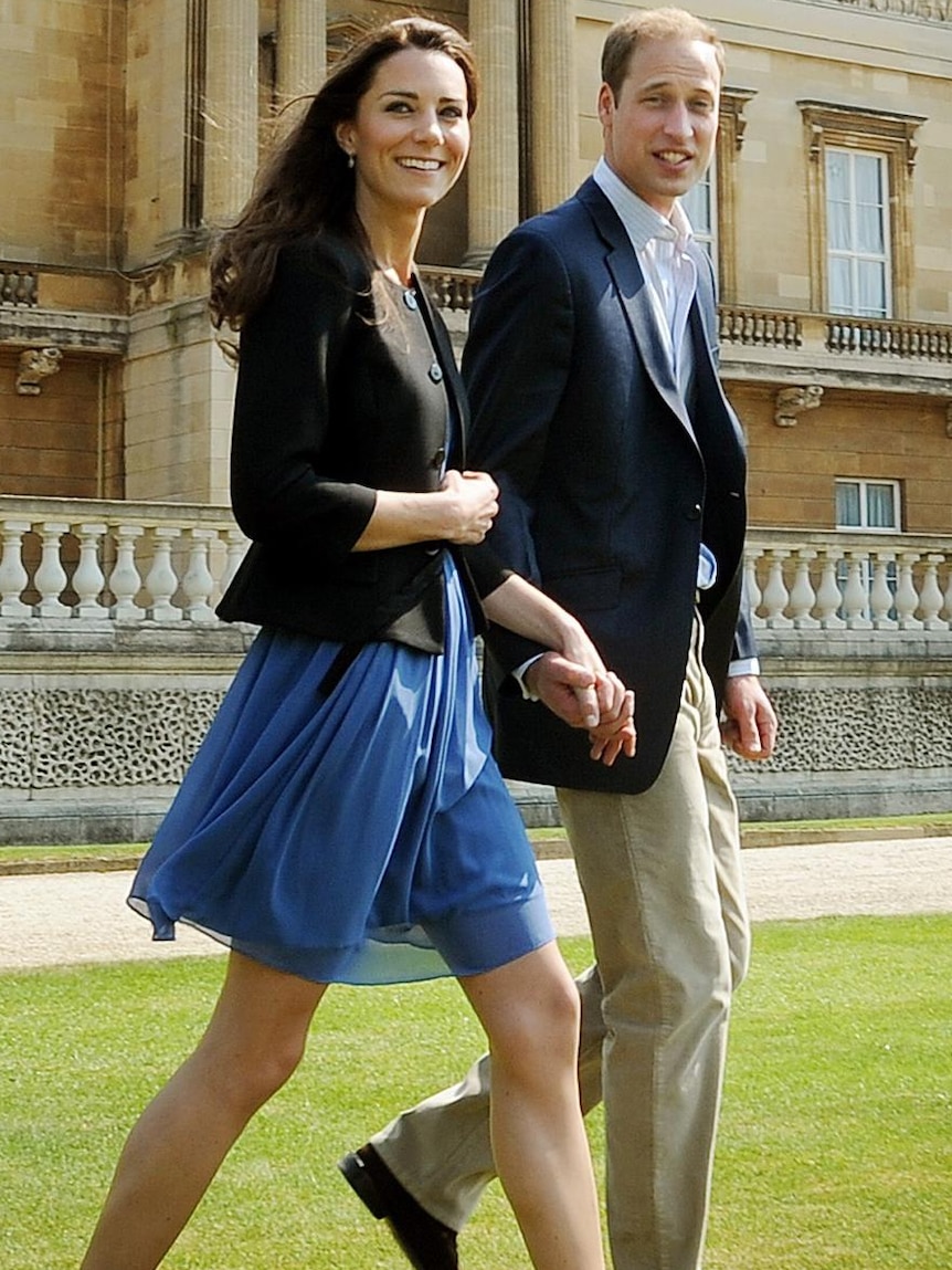 Royal couple stroll through palace