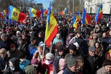 Moldovan protesters holding country's flags during an anti-government rally in the capital Chisinau.