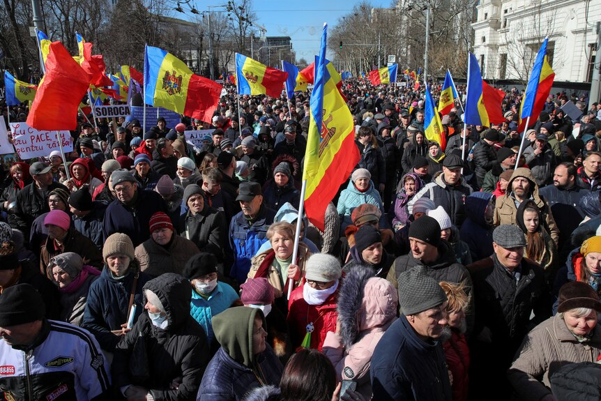 Moldovan protesters holding country's flags during an anti-government rally in the capital Chisinau.