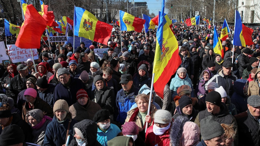 Moldovan protesters holding country's flags during an anti-government rally in the capital Chisinau.