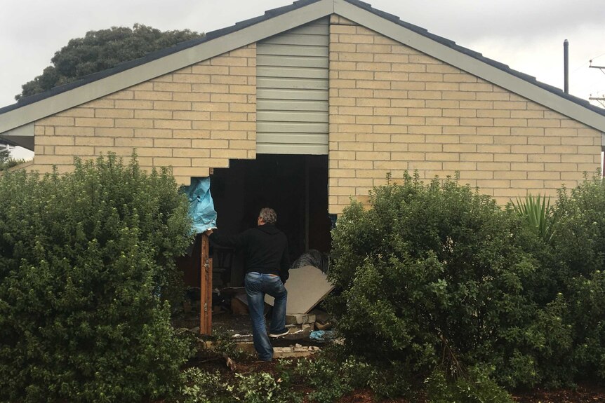 Damage to house after car crash in Goodwood, Hobart.