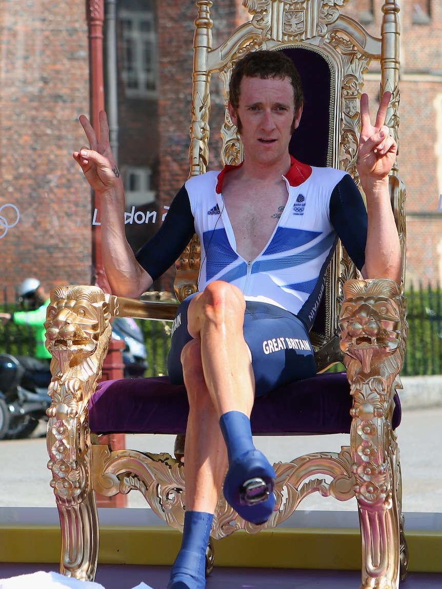 On top ... Bradley Wiggins celebrates after winning the men's time trial gold