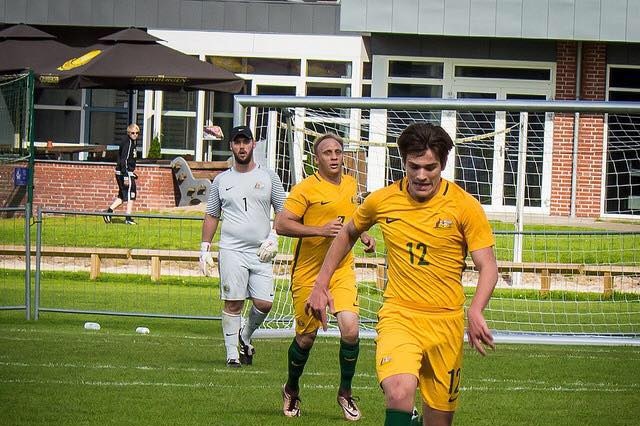 Matthew Hearne dribbles the ball while playing for Australia.