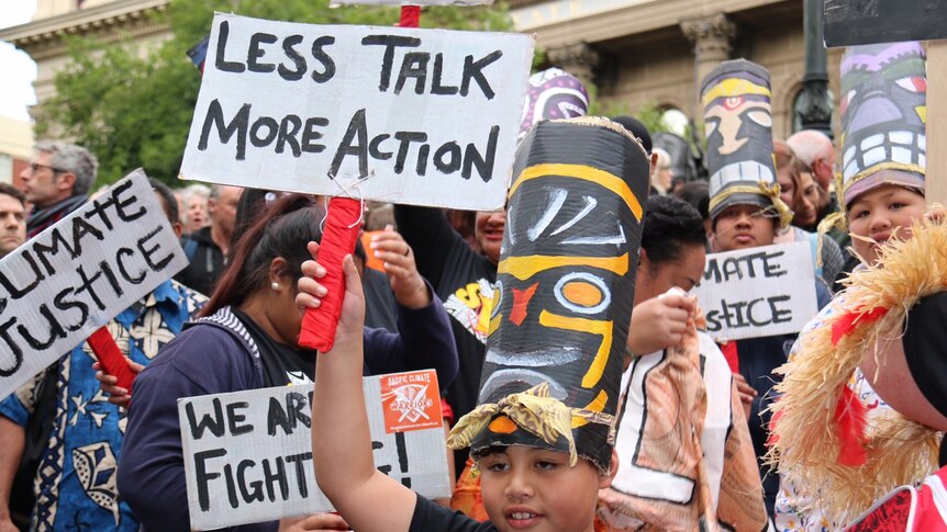 A boy at a climate change rally
