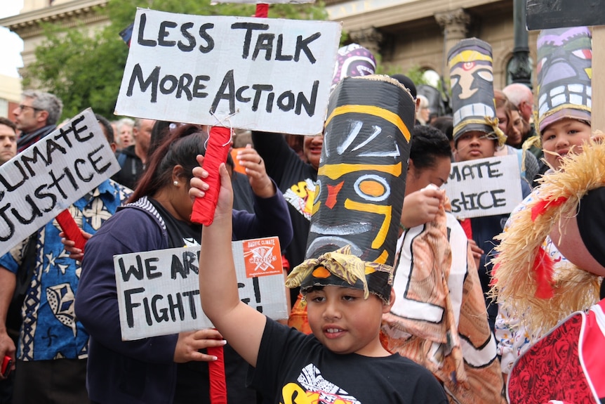 A boy at a climate change rally