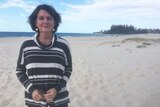 Qld state MP for Currumbin Jann Stuckey stands on Coolangatta Beach.