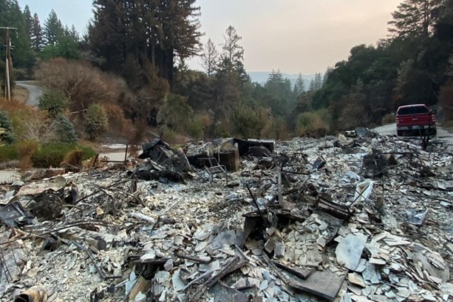 Rubble and ashes, remnants of a home left behind by fire.