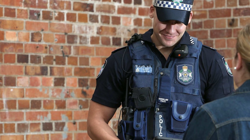 Queensland police officer wearing a body worn camera.