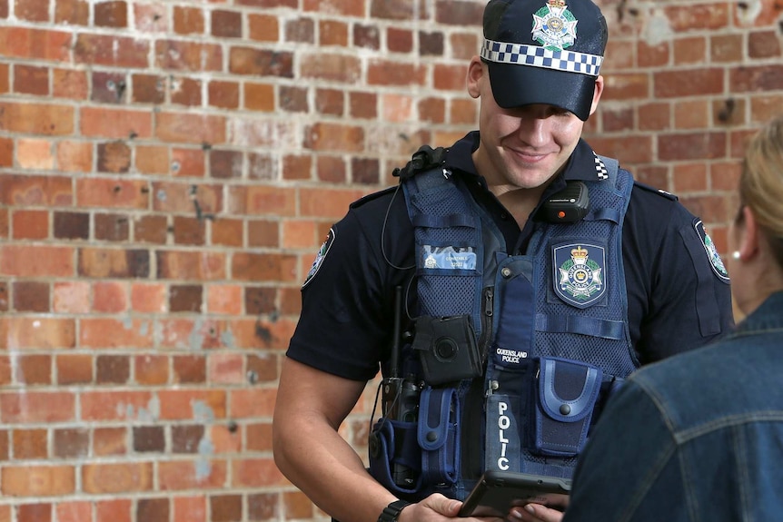 Queensland police officer wearing a body worn camera.