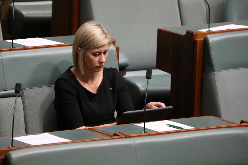 Susan Lamb looking down while sitting in Parliament.