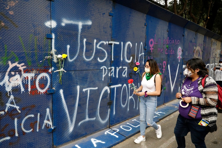 A wall of the Quintana Roo state offices sprayed with graffiti that reads in Spanish "Justice for Victoria,"