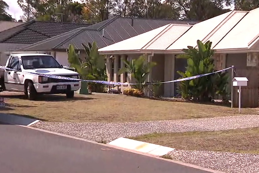 A house marked off with police tape