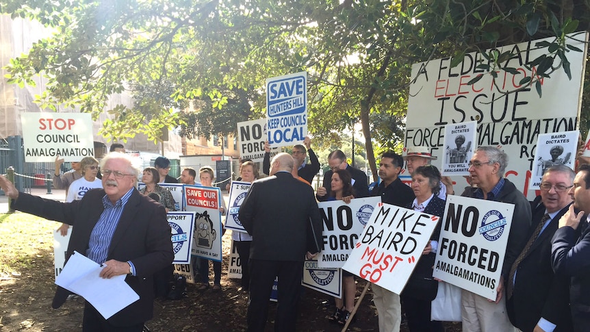 A protest outside NSW parliament against local government amalgamations.