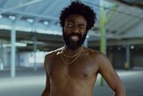 A still of Donlad Glover from Childish Gambino's 2018 video for 'This Is America'