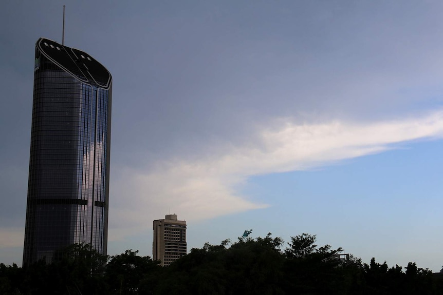 Grey clouds above a skyscraper