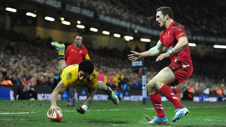 Wallabies wing Joe Tomane scores for Australia against Wales at the Millennium Stadium in Cardiff.