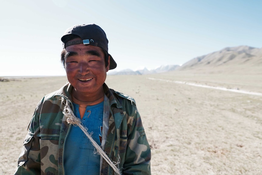 A mongolian sheepherder poses for the camera
