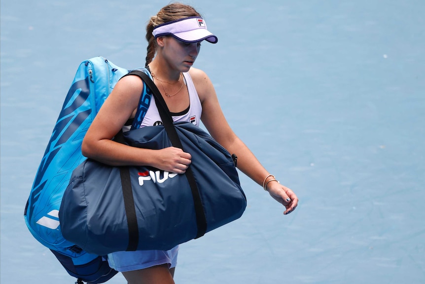 Sofia Kenin walks off the court after losing a match at the Australian Open.