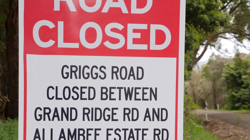 A closeup of a sign saying that Griggs Road is closed.