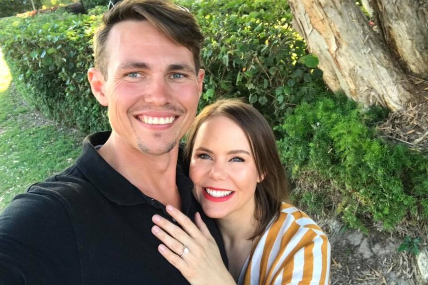 Ryan and Stacey Quinn pose for a selfie showing off her engagement ring for a story about what to do before buying a home.