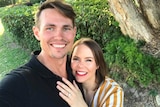 Ryan and Stacey Quinn pose for a selfie showing off her engagement ring for a story about what to do before buying a home.