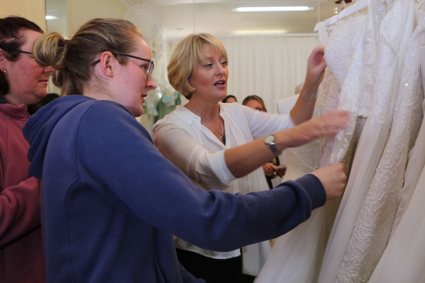 Anastasia Armstrong browses wedding dresses during a giveaway at a Perth bridal store