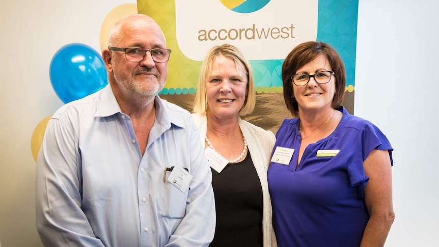 AccordWest CEO Neil Hamilton, Liberal MLC Robyn McSweeney and Mary Guadagnino South West TAFE stand in front of a banner.