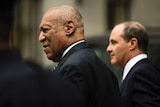 Bill Cosby walks accompanied by defence lawyer Brian McMonagle.