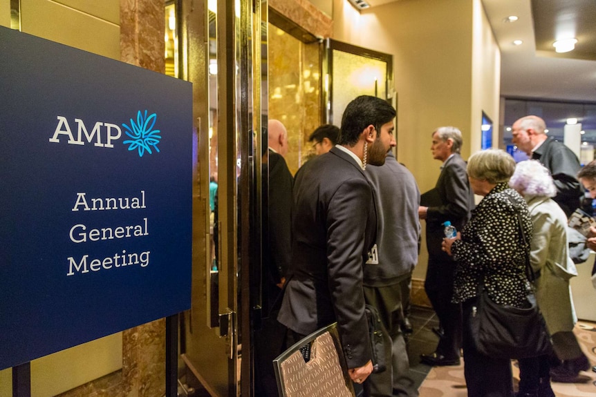 AMP shareholders walk past AGM sign, Melbourne Grand Hyatt, May 10, 2018