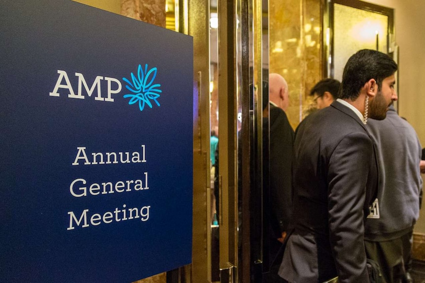 AMP shareholders walk past AGM sign, Melbourne Grand Hyatt