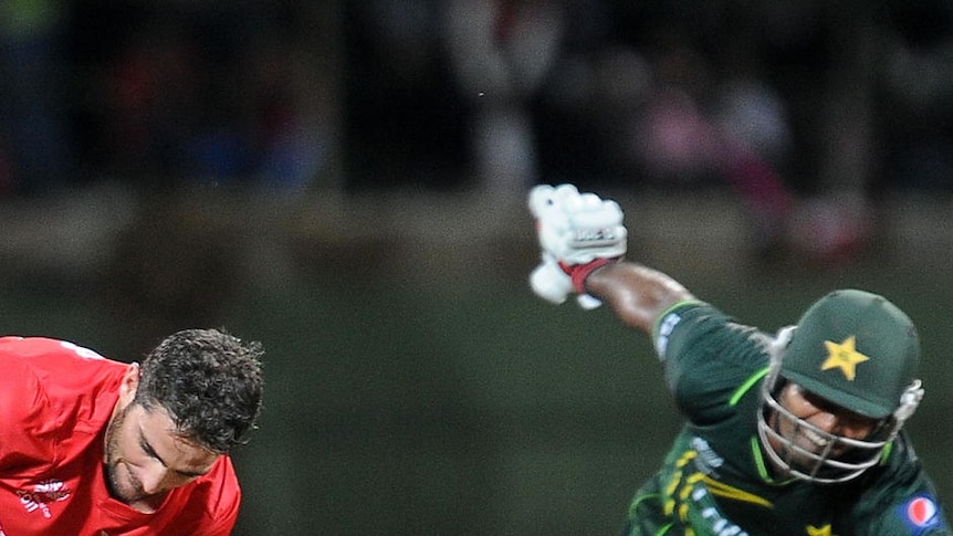 Zimbabwe spinner Ray Price unsuccessfully attempts to run out Pakistan top-scorer Asad Shafiq.