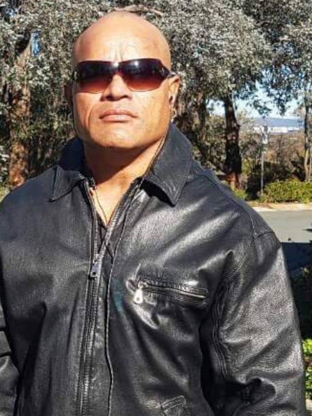 Pitasoni Ulavalu wearing sunglasses and a leather jacket.