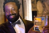 Marlon James, with his Man Booker Prize for Fiction award at the presentation ceremony in London.