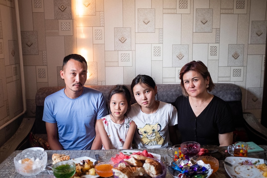  Khanzaada sits with her family at the dinner table