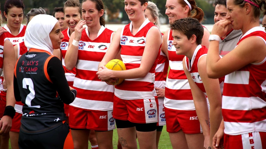 Amna Karra-Hassan mentoring women's Aussie Rules team