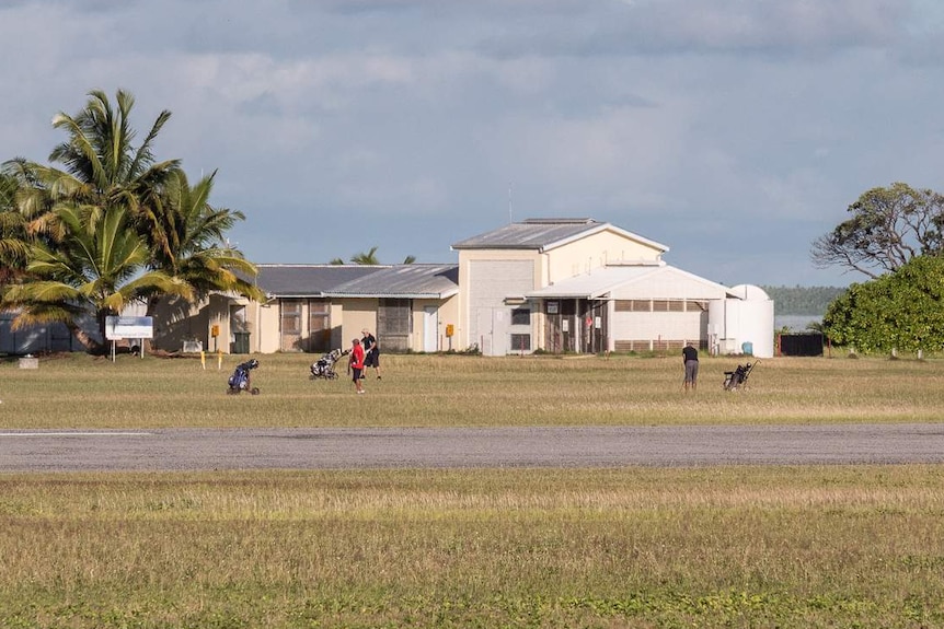 The golf course extends across the runway to the Bureau of Meteorology office by the lagoon.