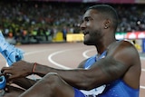 Justin Gatlin lies on the track after beating Usain Bolt