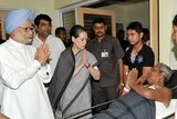 Singh, Gandhi visit massacre victims