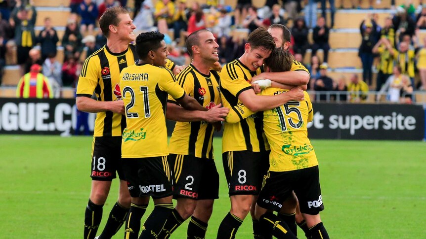 Wellington Phoenix celebrate Jason Hicks's late equaliser against Newcastle