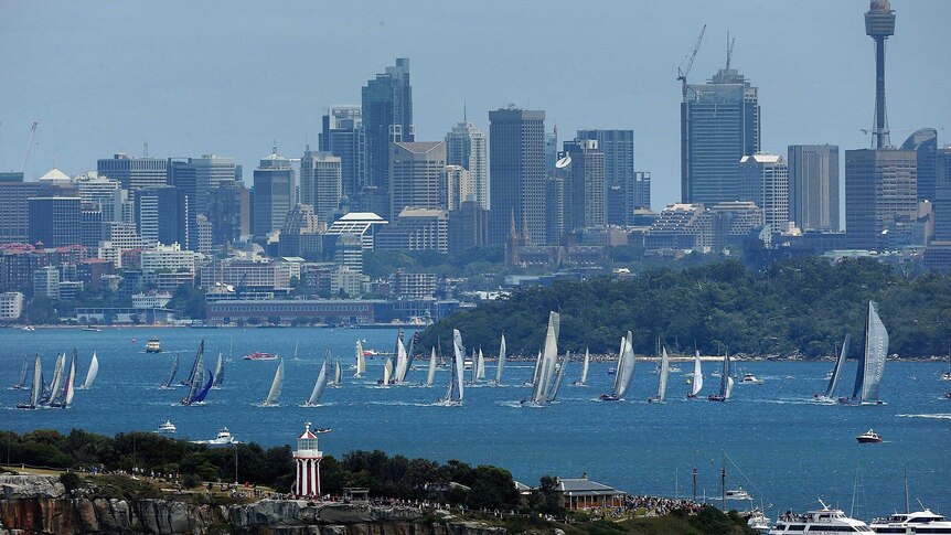 The fleet moves away from the start line of the 2012 Sydney to Hobart yacht race.