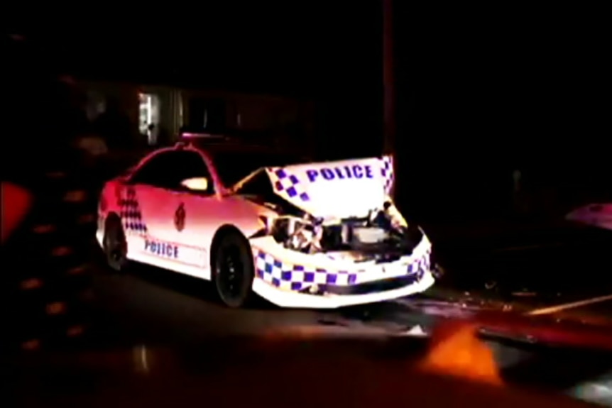 A damaged Queensland police car about to be towed