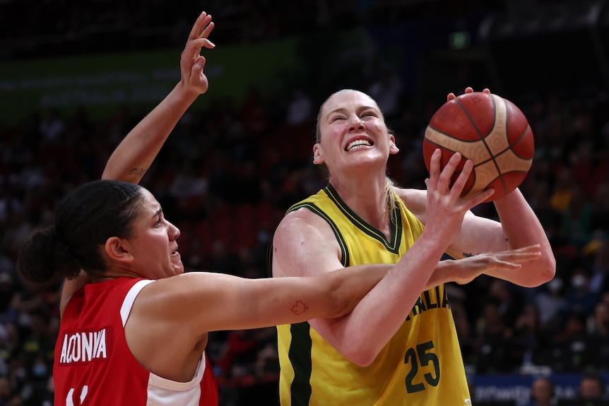Lauren Jackson carries the ball while under pressure from a defender